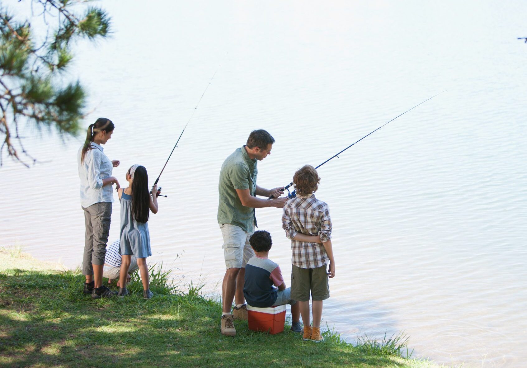 Family fishing lakeside